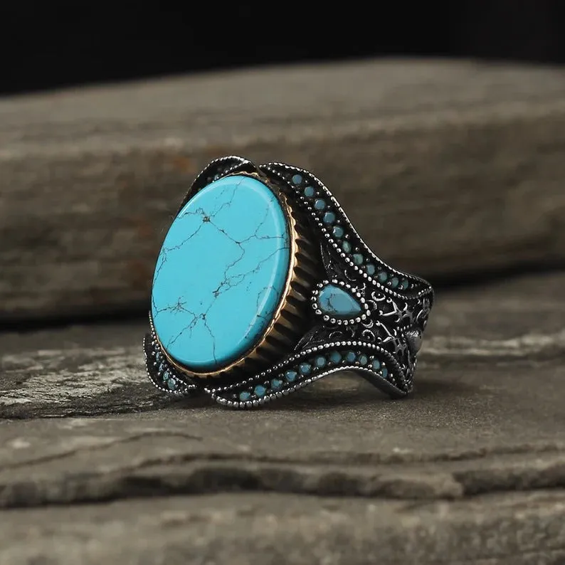 Men's round turquoise ring with antique silver alloy band, side view