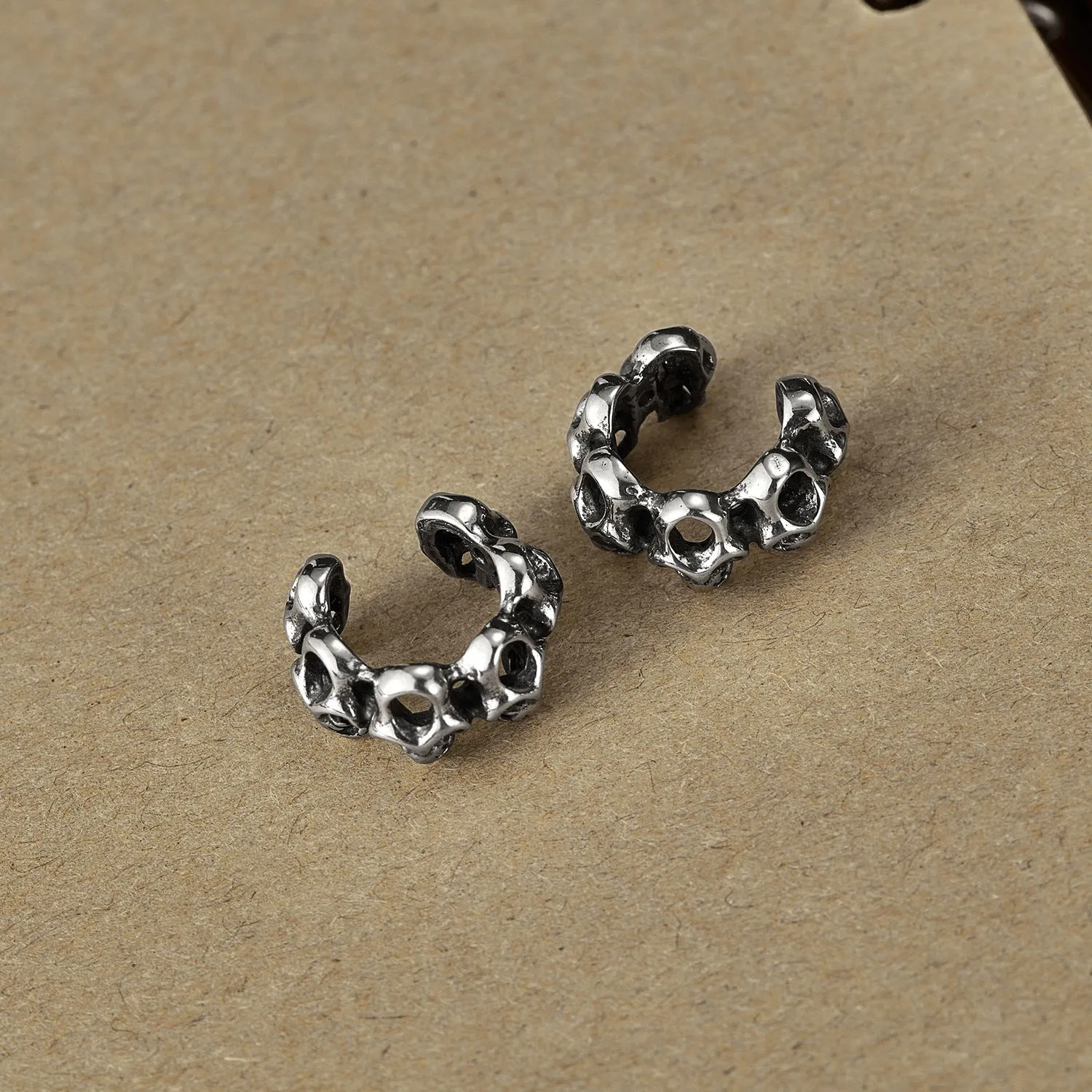 Stainless steel hollow skull ear clip earrings with geometric shape and retro design