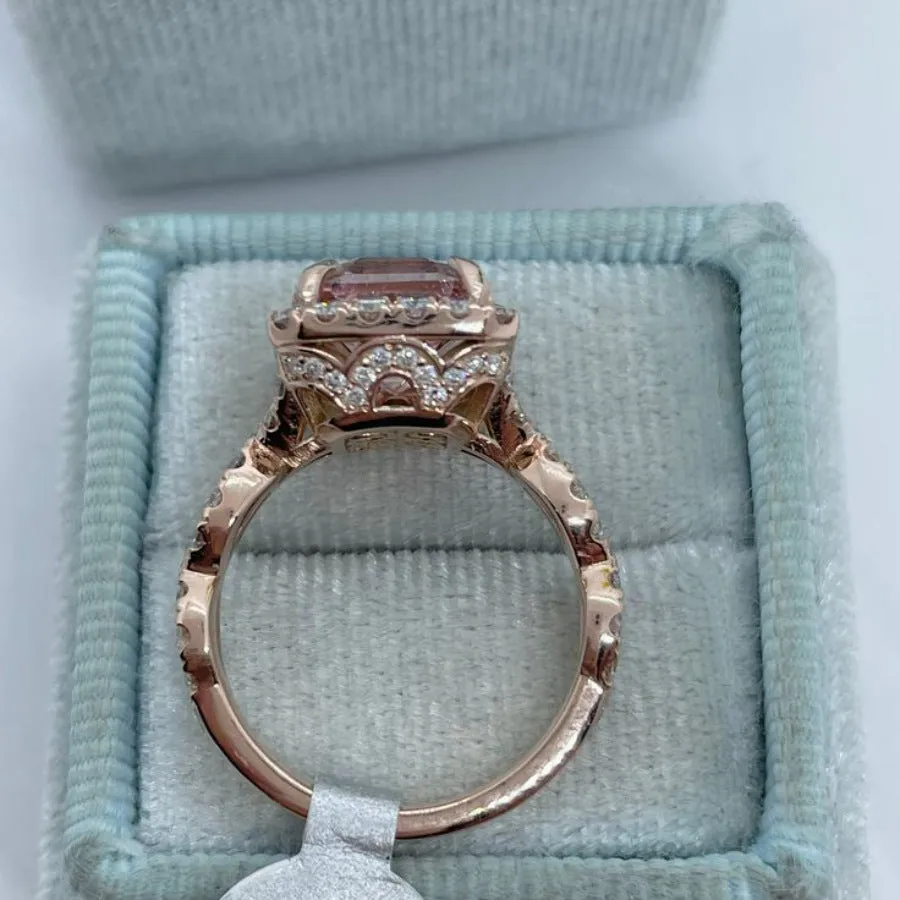 Rose gold electroplated alloy ring with geometric shape on white background