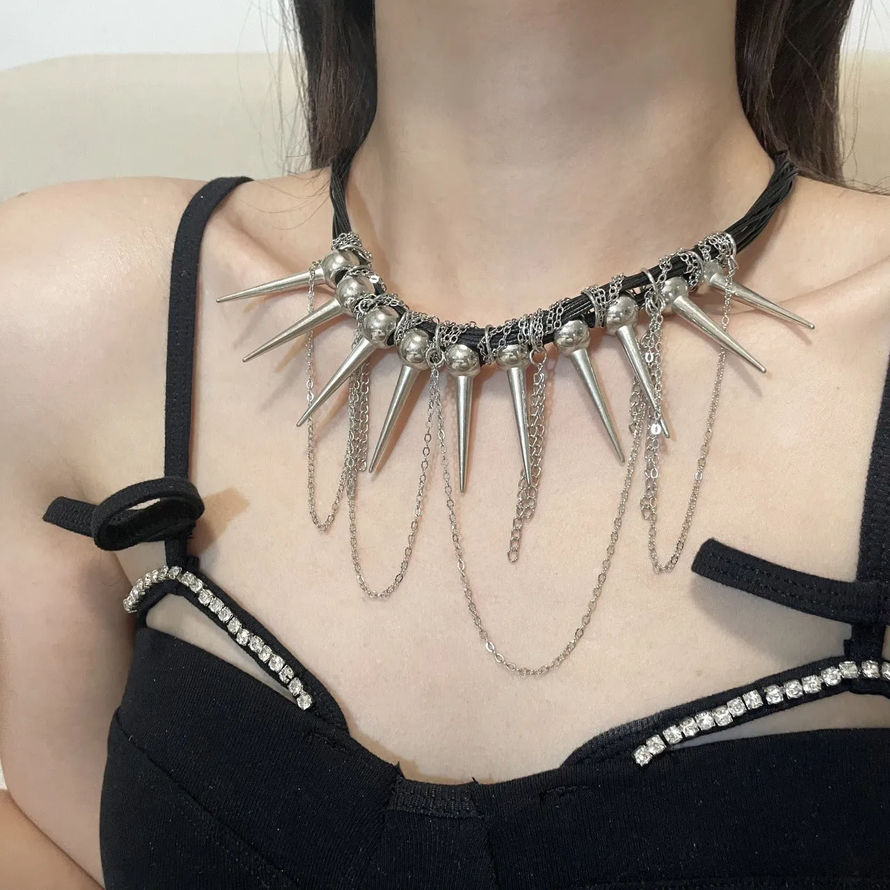 Women's casual leather necklace with electroplated rivets and winding round beads in picture colour.