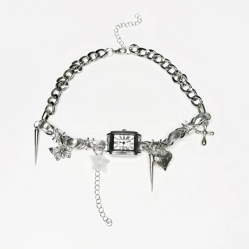 Dark multi-layer cross necklace with twin clavicle chains showing adjustable length and alloy construction