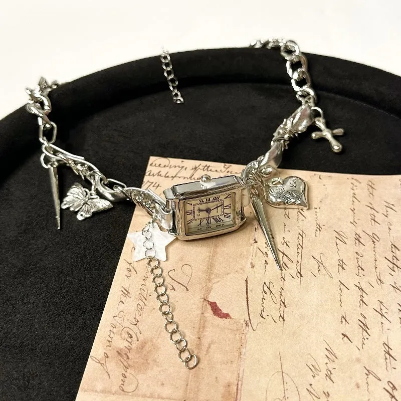 Dark multi-layer cross necklace with twin clavicle chains showing adjustable length and alloy construction