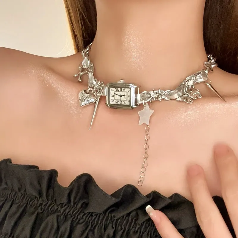 Dark multi-layer cross necklace with twin clavicle chains showing adjustable length and alloy construction