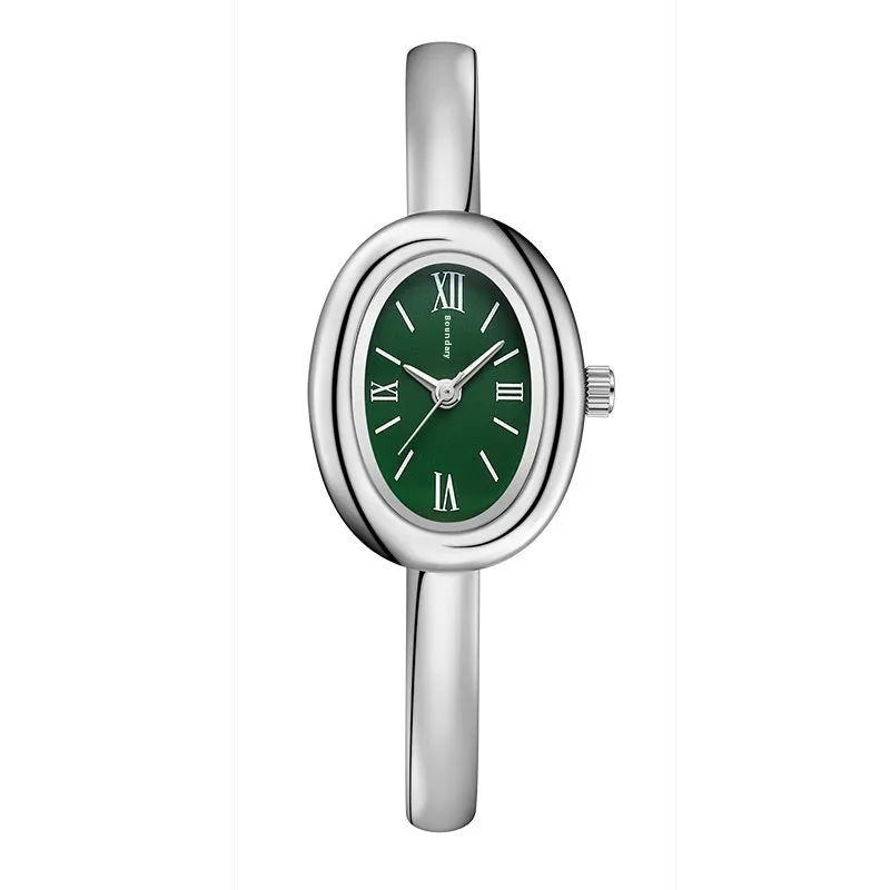 Women's oval retro quartz watch in gold spiral pattern on a white background