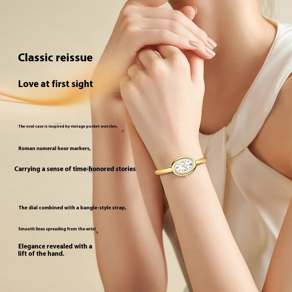 Women's oval retro quartz watch in gold spiral pattern on a white background
