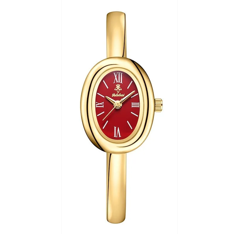 Women's oval retro quartz watch in gold spiral pattern on a white background