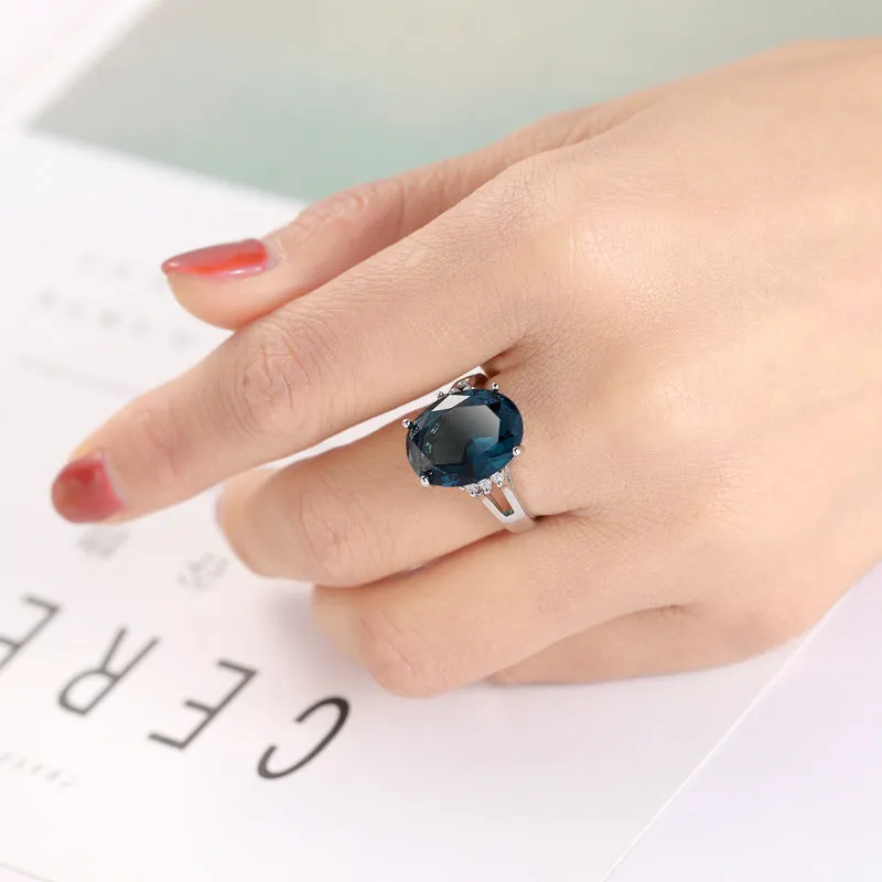 Blue black decorative ring with geometric ellipse shape and electroplated copper finish, unisex style