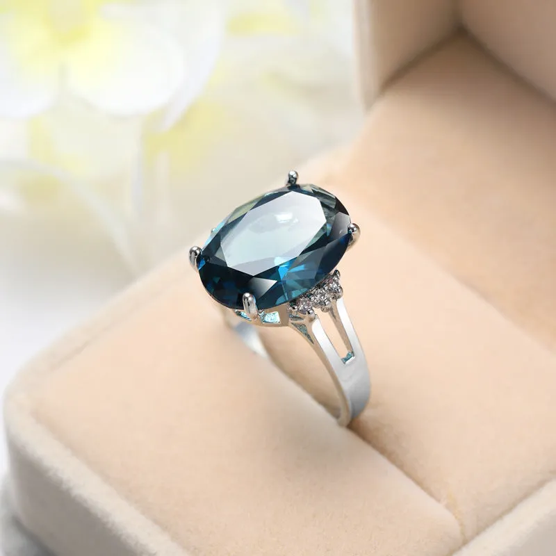Blue black decorative ring with geometric ellipse shape and electroplated copper finish, unisex style