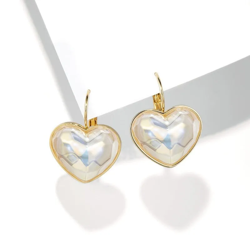 A pair of gold coloured alloy clip-on ear clip earrings for women.