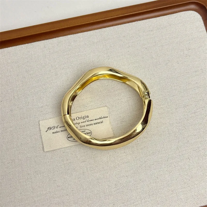 Irregular wide-brimmed zinc alloy bracelet with spring open design and electroplated finish in simple style
