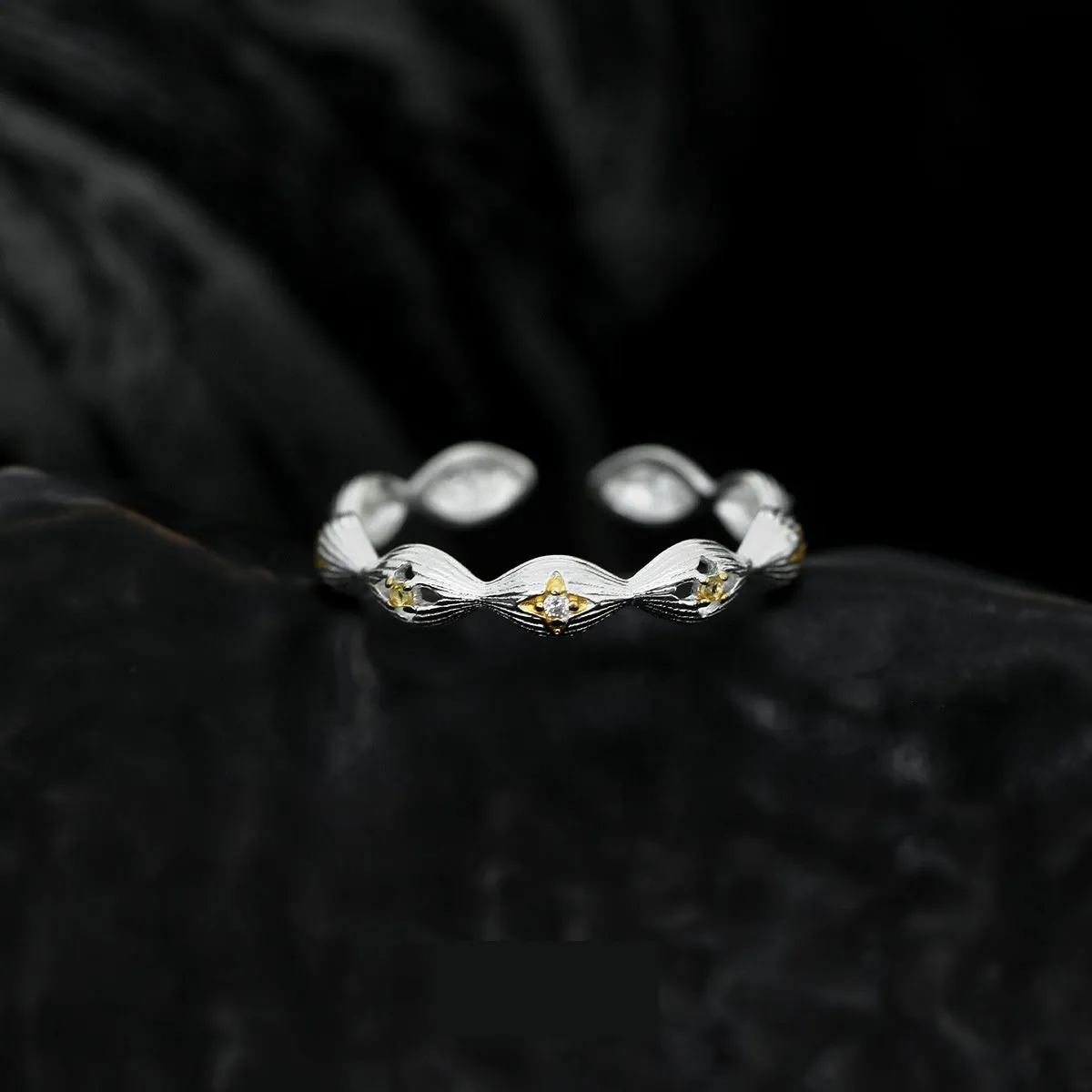 Buccherati brushed star ring in silver gold electroplated finish with adjustable opening on a white background