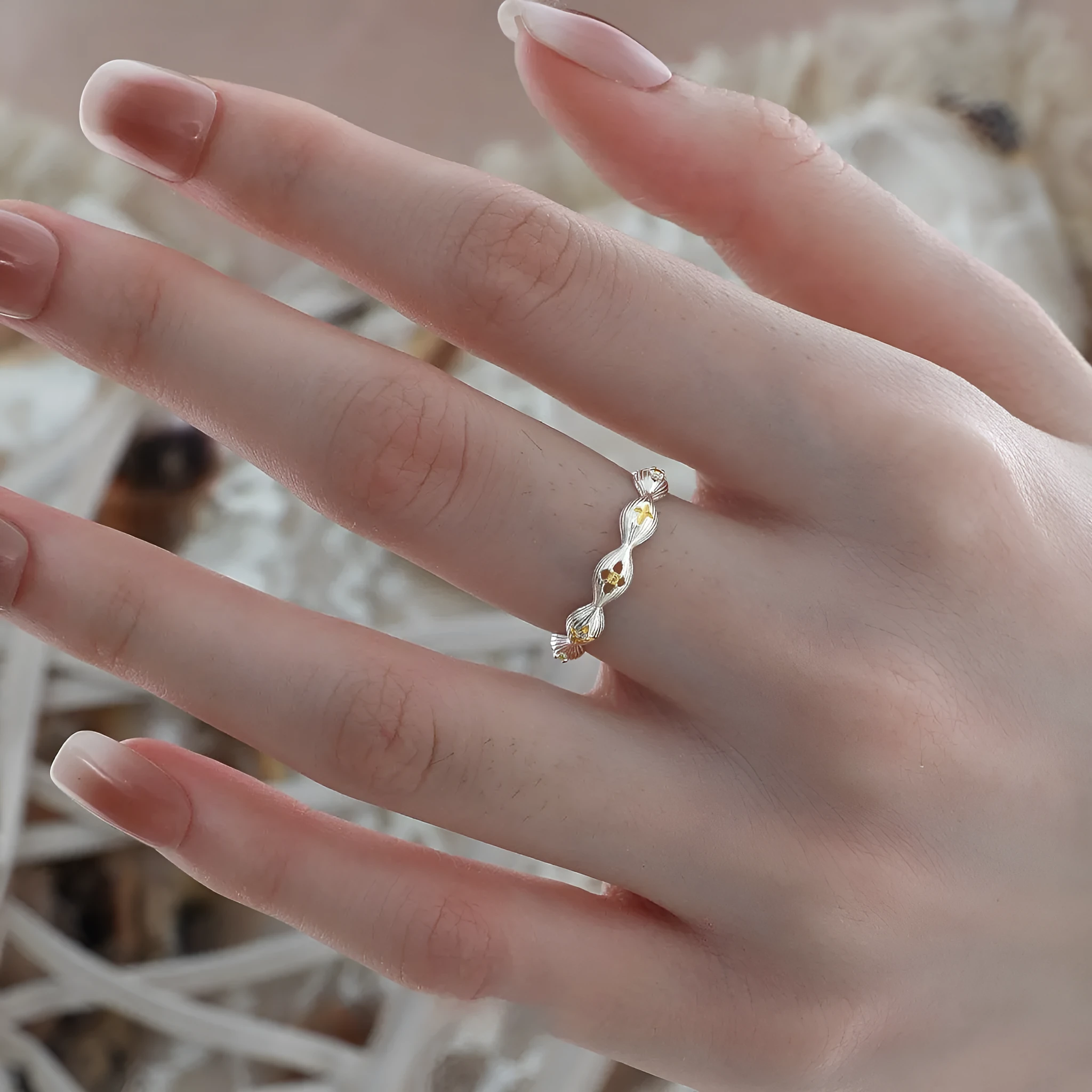 Buccherati brushed star ring in silver gold electroplated finish with adjustable opening on a white background