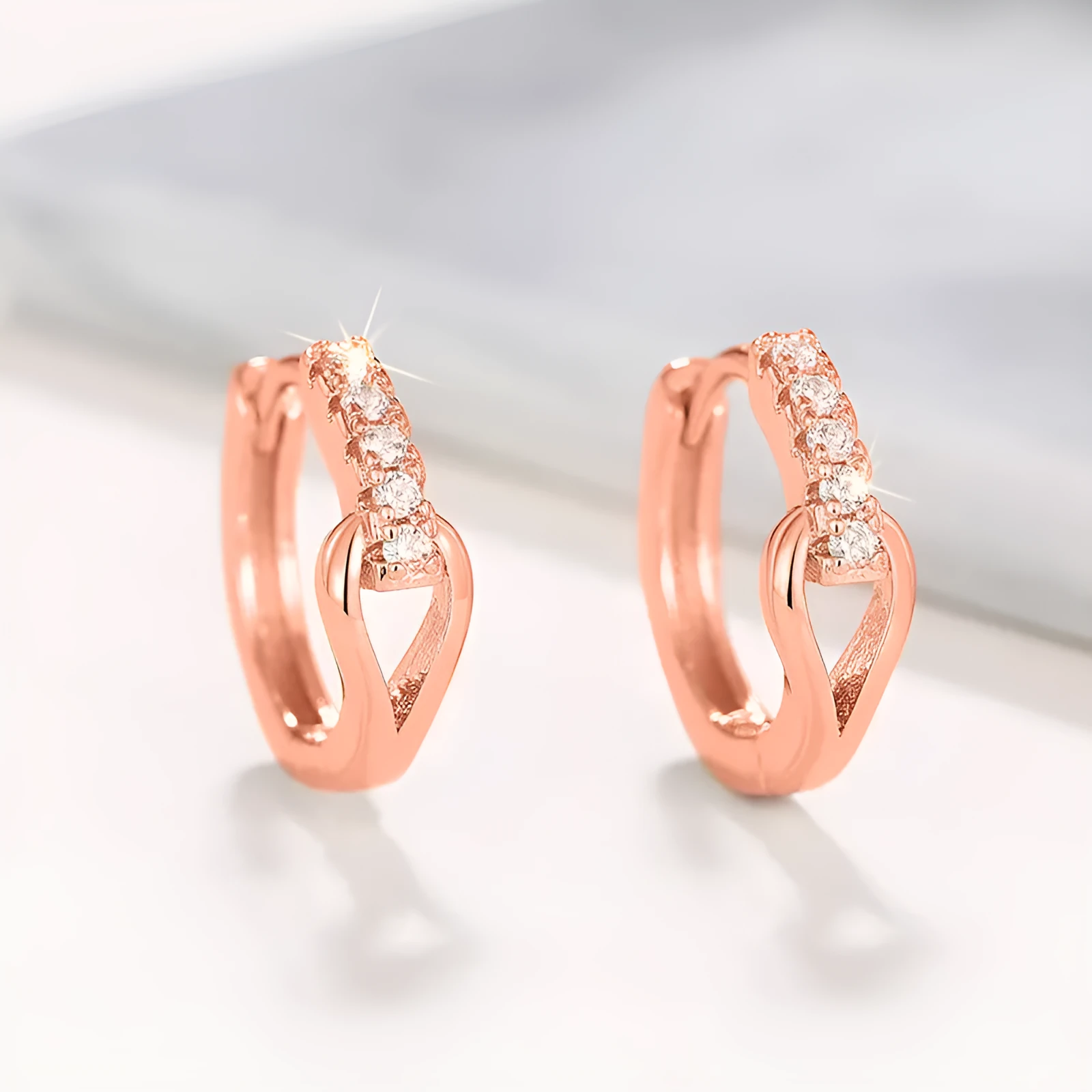 Copper geometric earrings with inlaid zircon in white gold colour on women