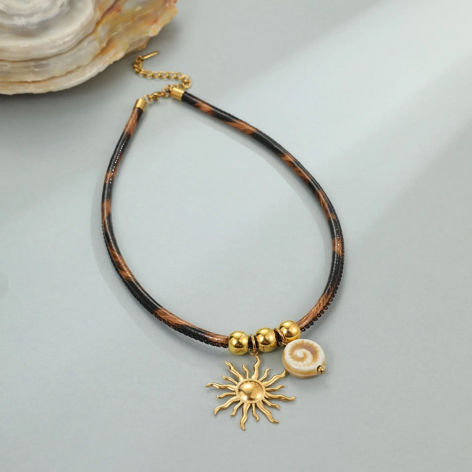 Geometric leopard head stainless steel necklace with gold electroplated finish on adjustable chain