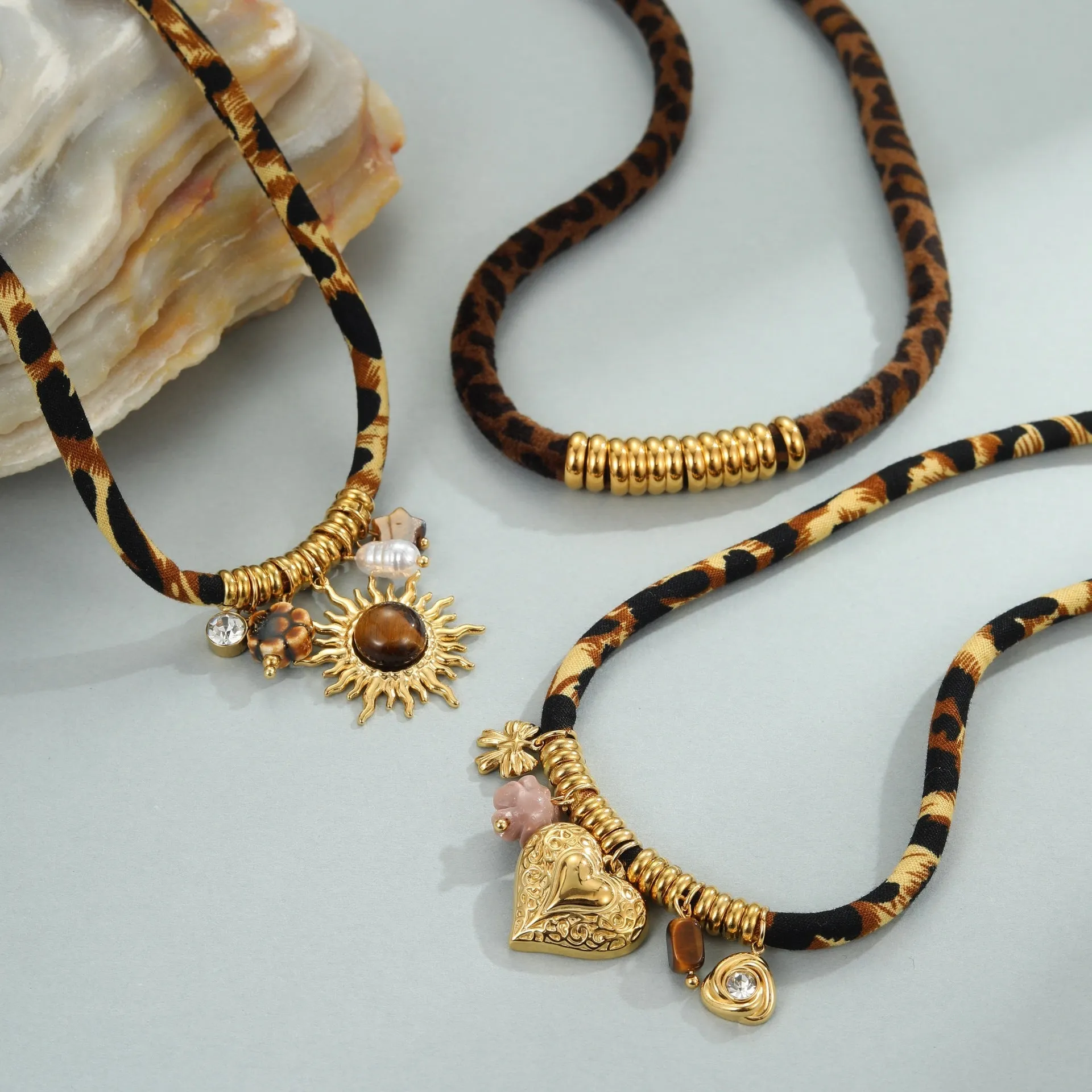 Geometric leopard pendant necklace with electroplated 18K gold finish on stainless steel chain