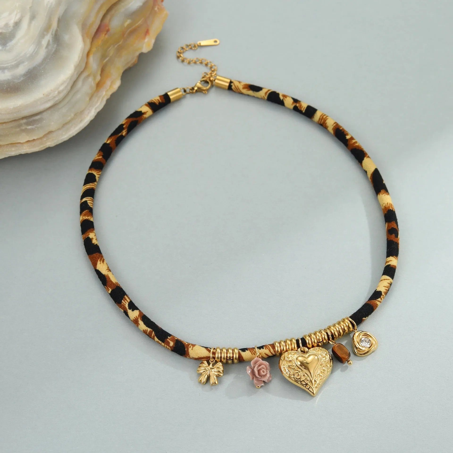 Geometric leopard pendant necklace with electroplated 18K gold finish on stainless steel chain
