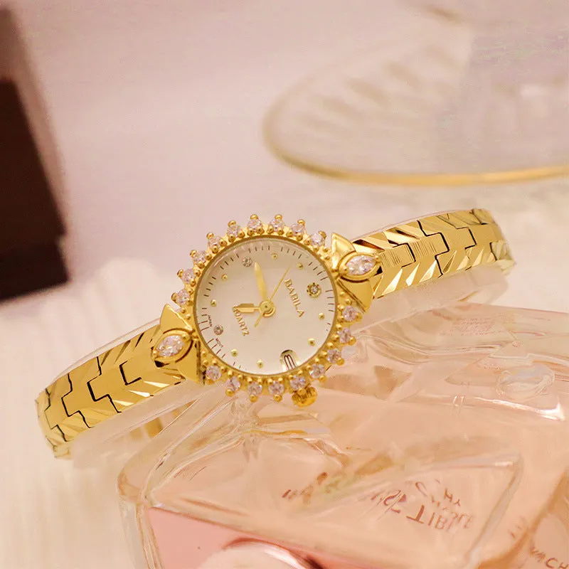 Women's vintage quartz watch with gold face and diamond embossed bracelet, slim 6mm design on a neutral background