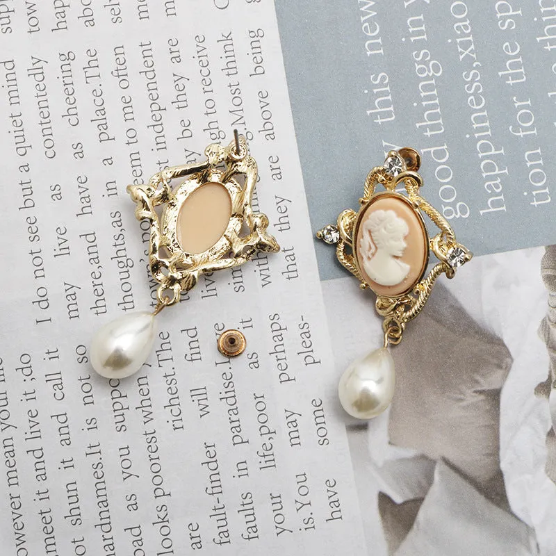 Gold alloy retro embossed geometric earrings on a surface