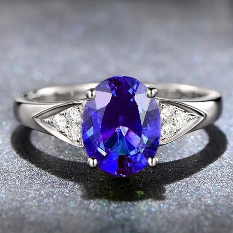 Women's court style ring with a choice of heart, water drop, or bell zircon pattern in blue, green, light blue, or red.
