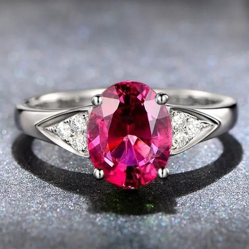 Women's court style ring with a choice of heart, water drop, or bell zircon pattern in blue, green, light blue, or red.