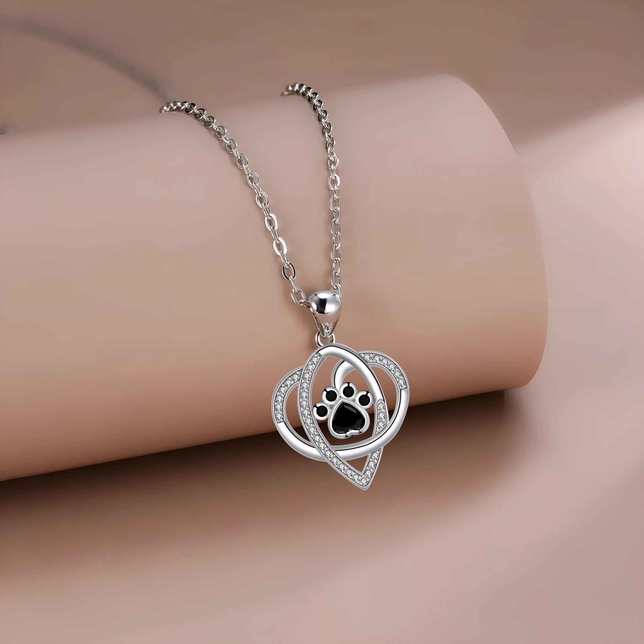 Women's copper necklace with dog paw pendant on cross chain
