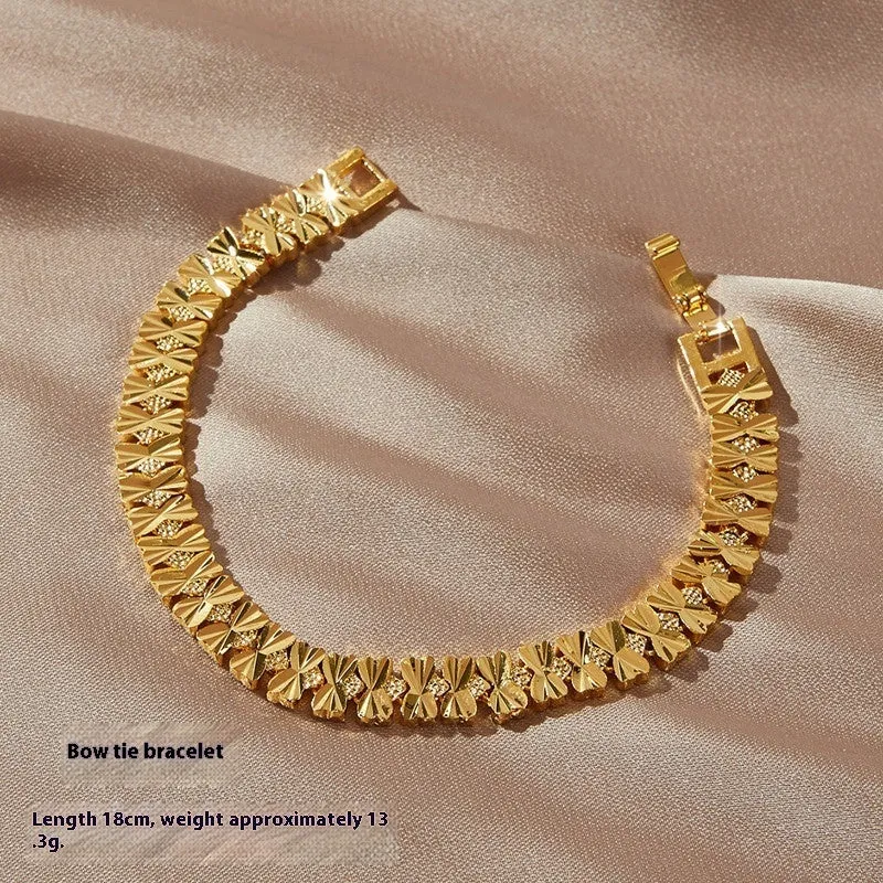 Gold brass heart-shaped fashion bracelet for women with electroplated finish on flat surface