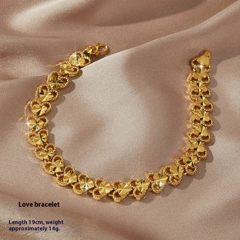Gold brass heart-shaped fashion bracelet for women with electroplated finish on flat surface