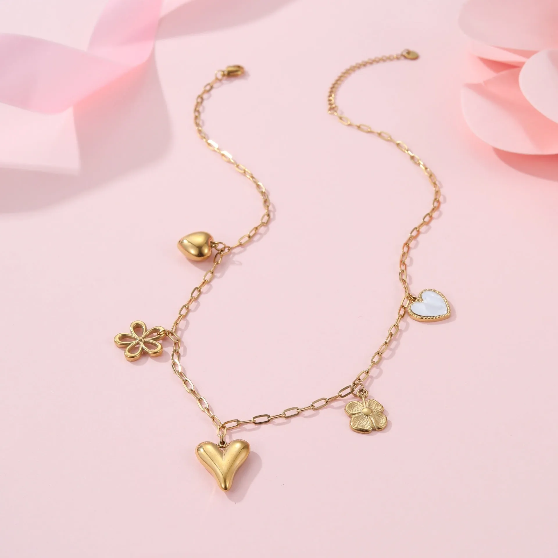 Sun Love pendant necklace in stainless steel with 18K electroplate, showing Heart and Ribbon Sun design options.