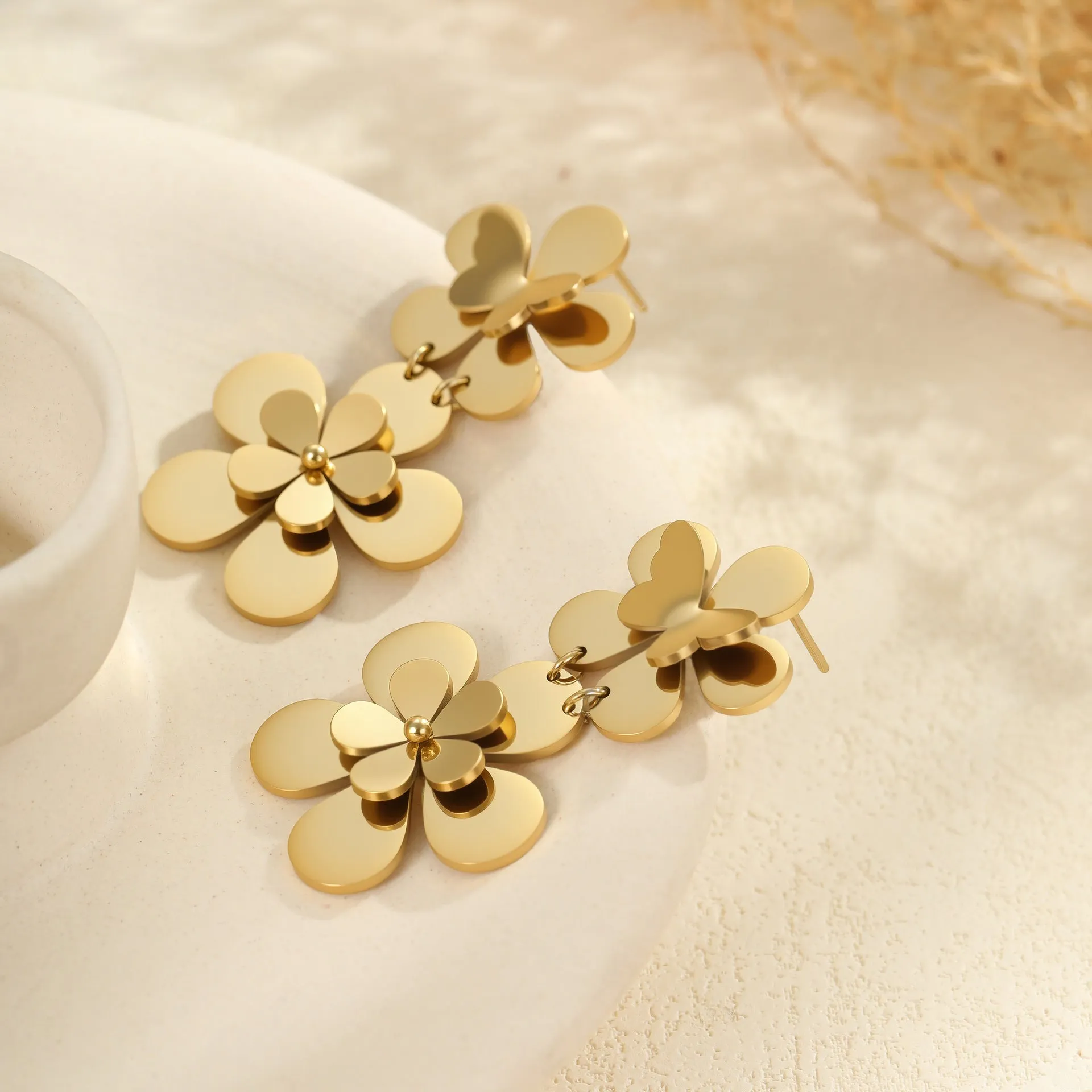 Gold flower butterfly stainless steel earrings for women with geometric details