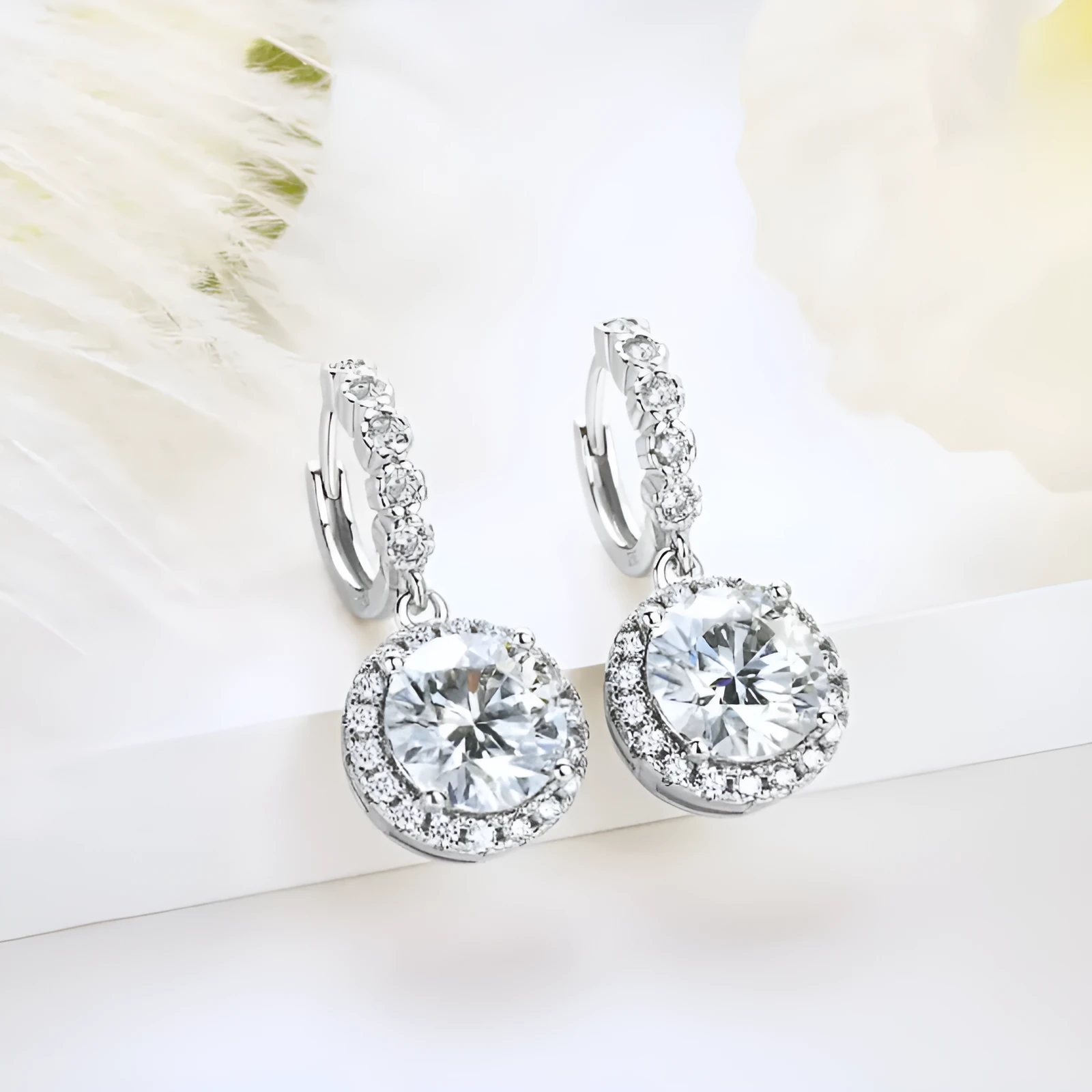 Shiny white gold copper geometric earrings for women with round ring shape on a white background