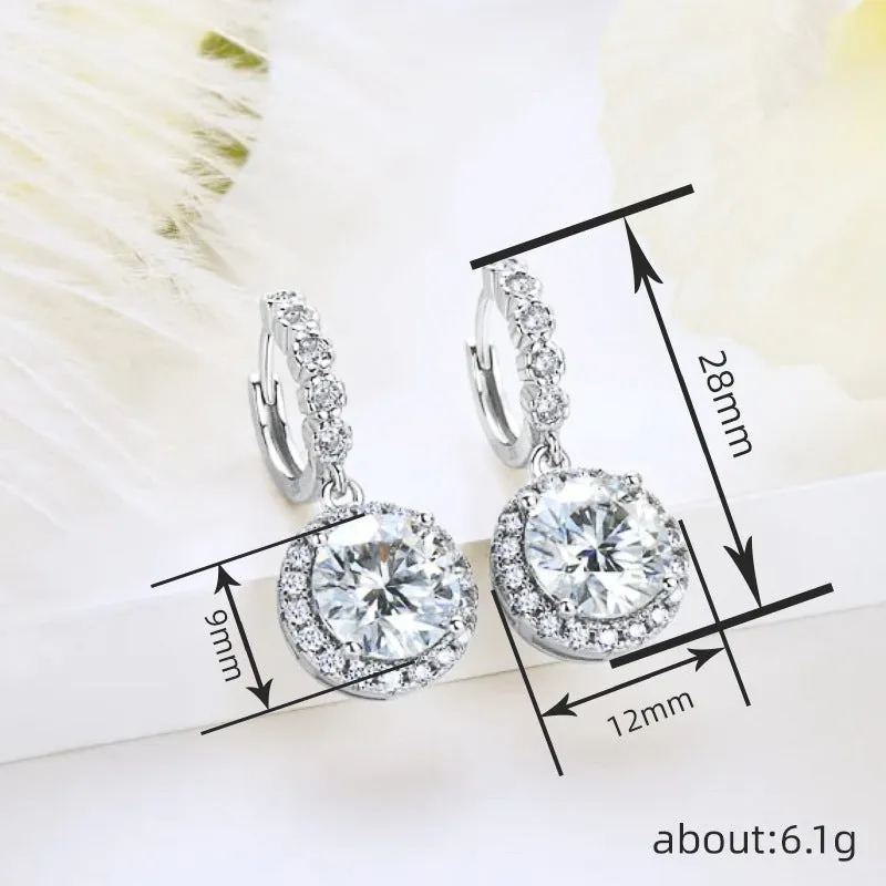 Shiny white gold copper geometric earrings for women with round ring shape on a white background