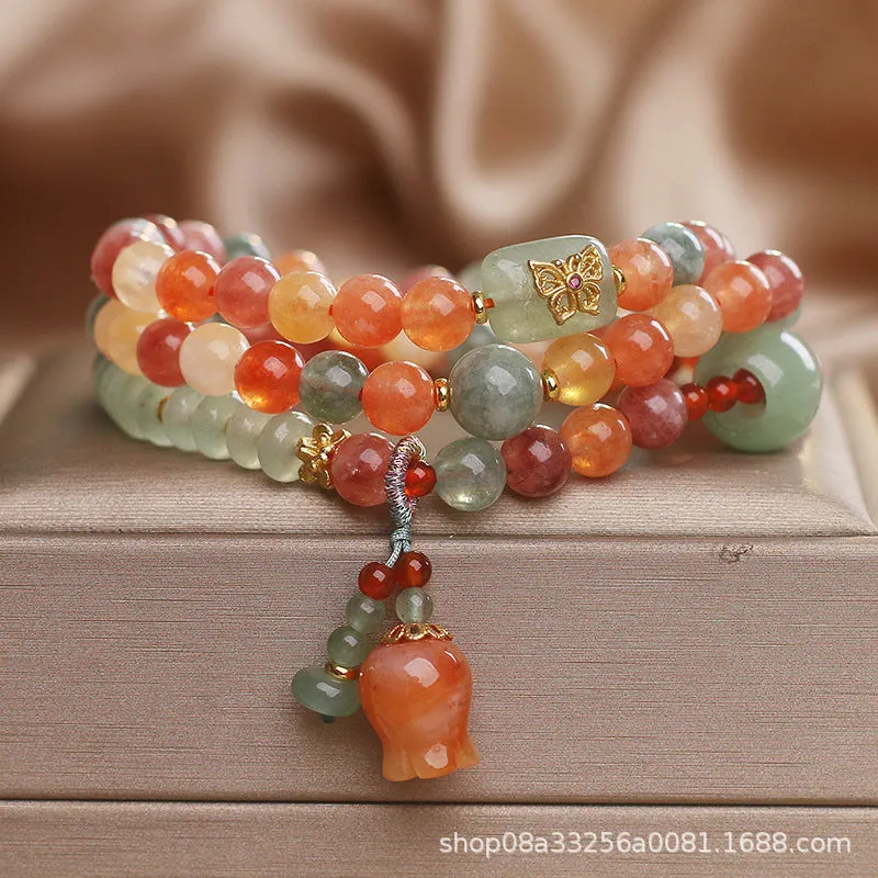 Natural Jinsi Jade multi-circle bracelet with round beads and lily pendant on display