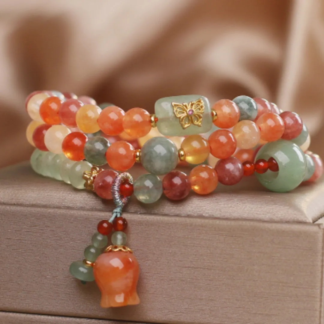 Natural Jinsi Jade multi-circle bracelet with round beads and lily pendant on display