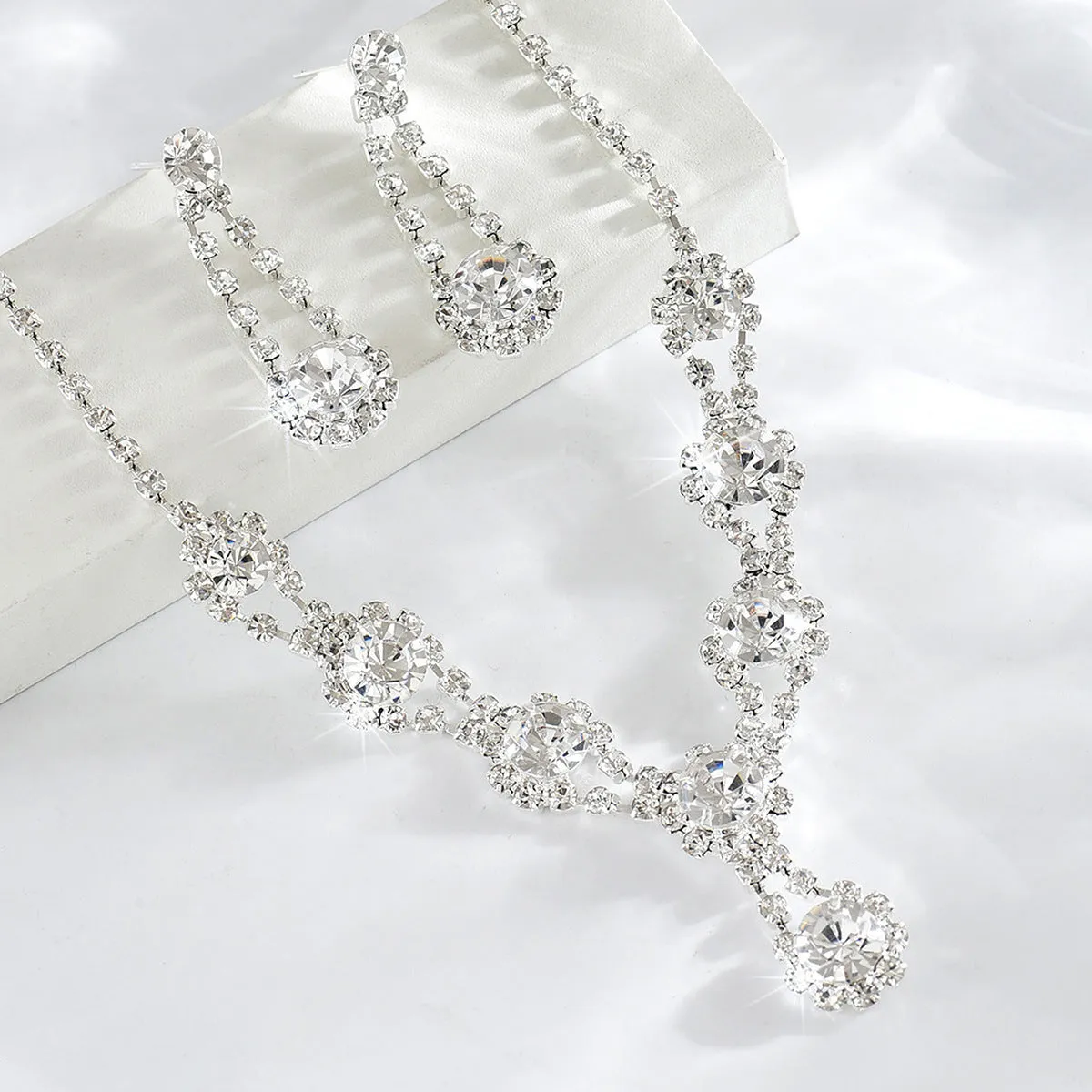 Rhinestone crystal necklace and earrings set in silver colour