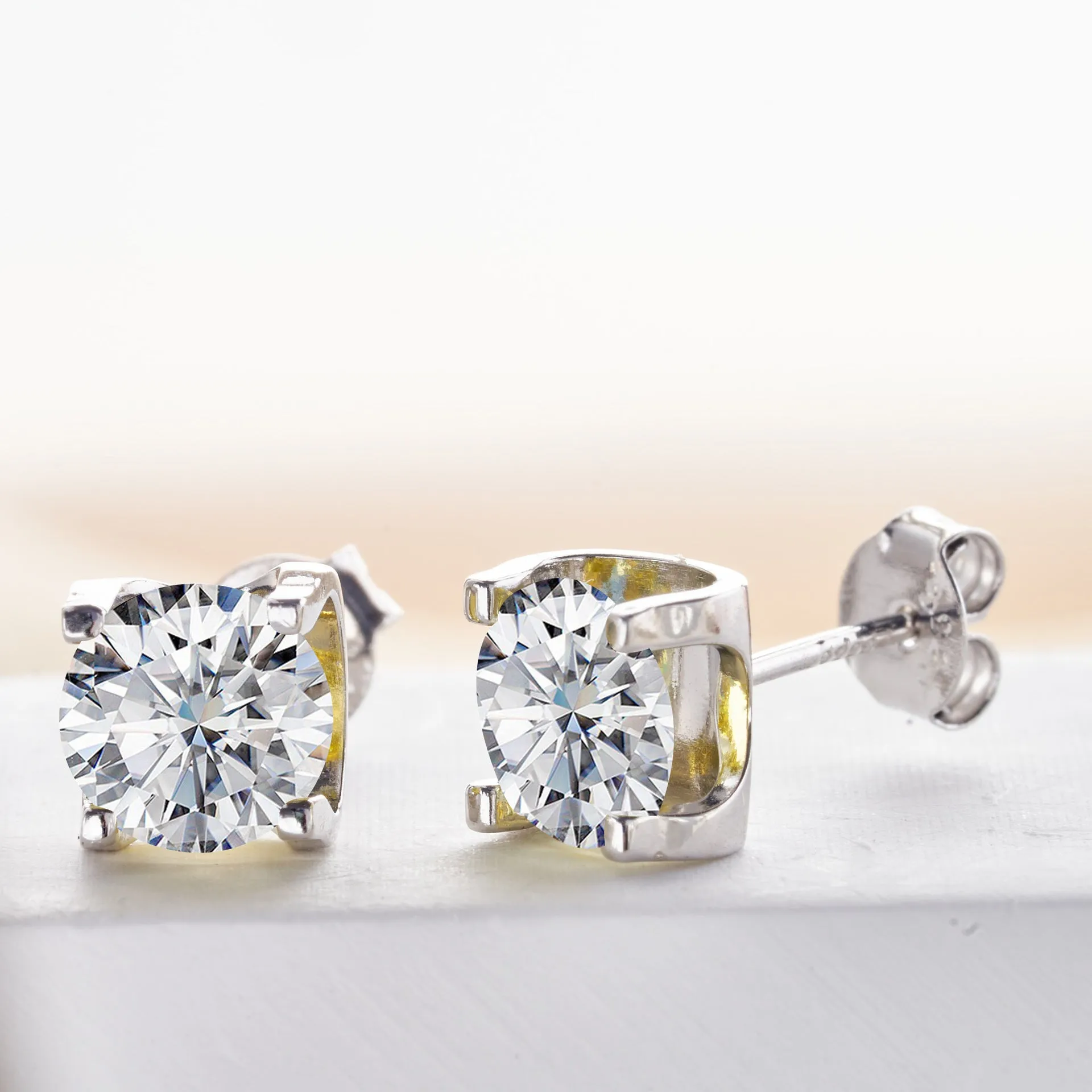 Micro inlaid moissanite stud earrings in S925 sterling silver with round natural stones, unisex design, 1CT per pair
