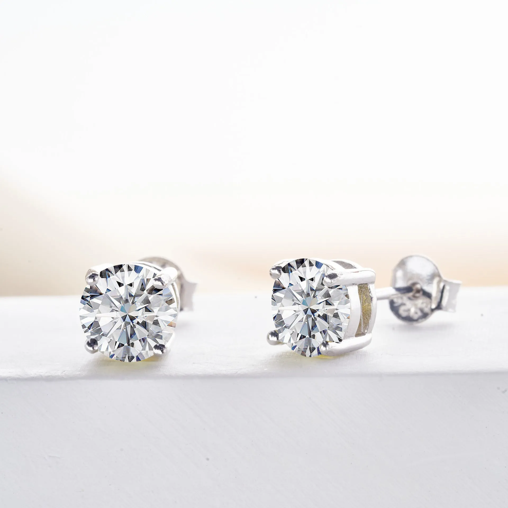 Micro inlaid moissanite stud earrings in S925 sterling silver with round natural stones, unisex design, 1CT per pair