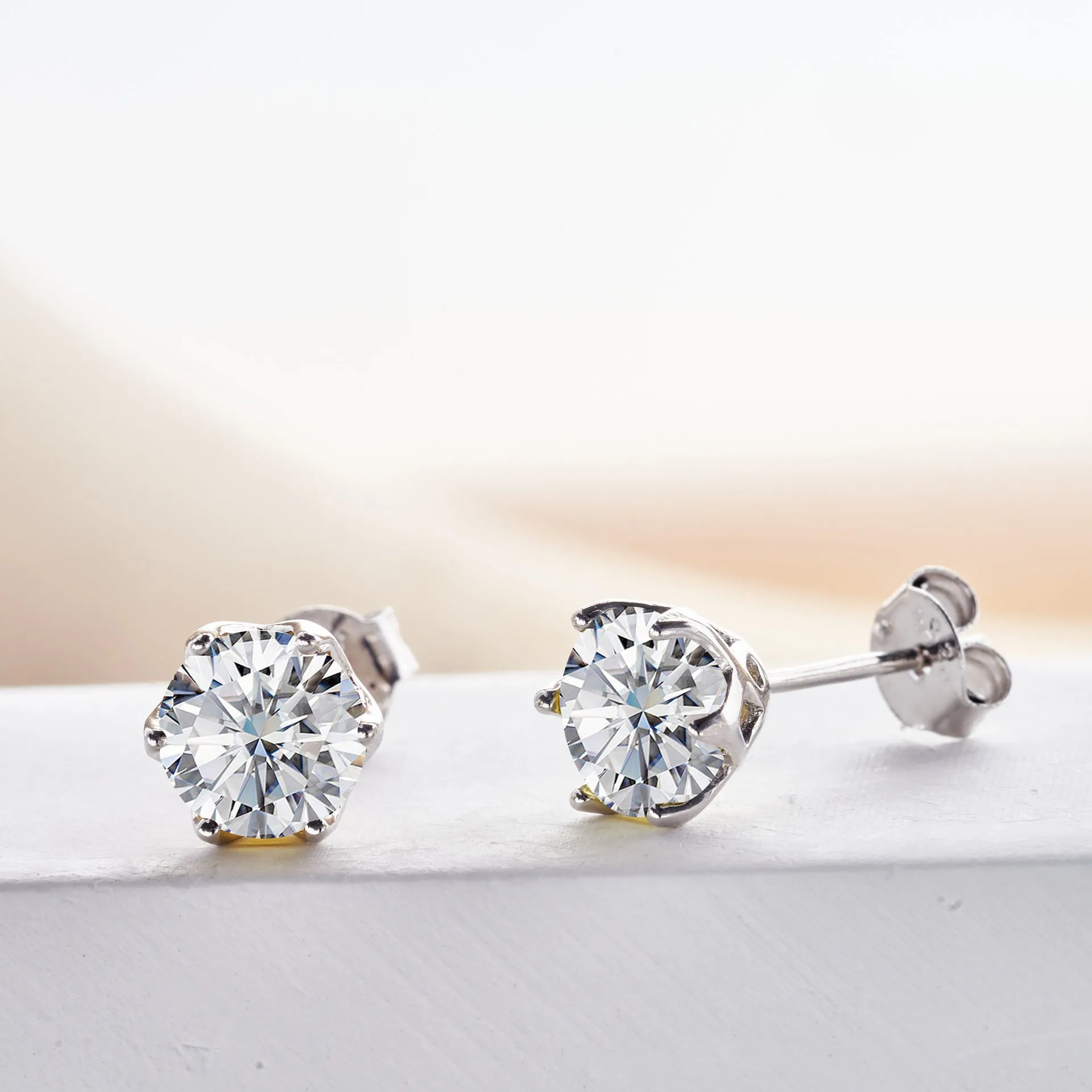 Micro inlaid moissanite stud earrings in S925 sterling silver with round natural stones, unisex design, 1CT per pair