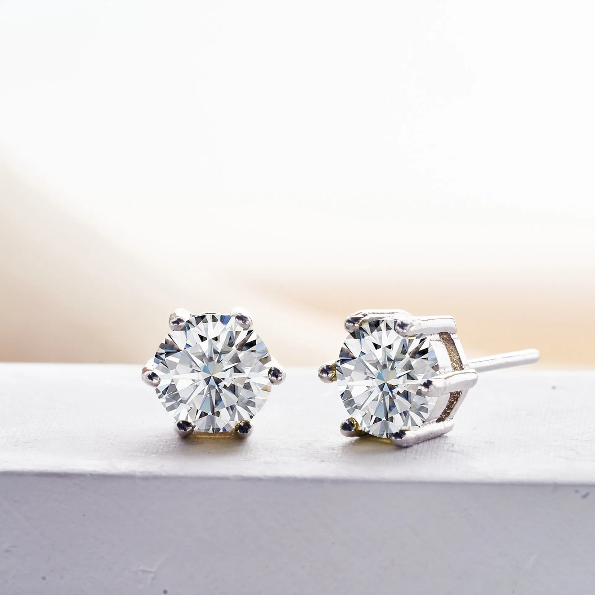 Micro inlaid moissanite stud earrings in S925 sterling silver with round natural stones, unisex design, 1CT per pair