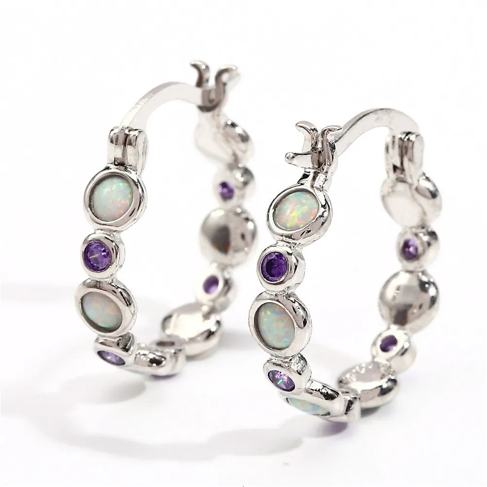 Round copper earrings with synthetic opal and cubic zirconia in platinum white finish