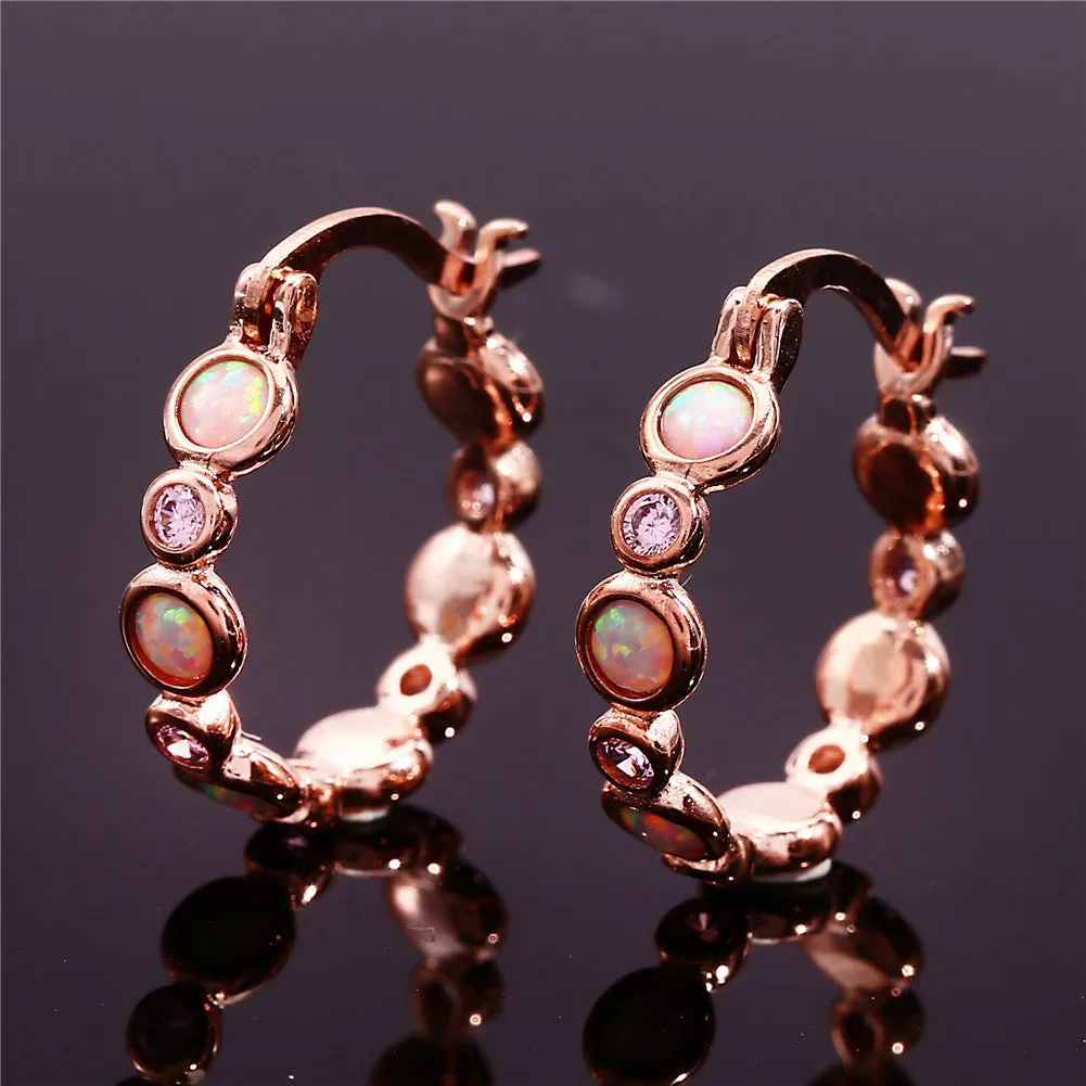 Round copper earrings with synthetic opal and cubic zirconia in platinum white finish