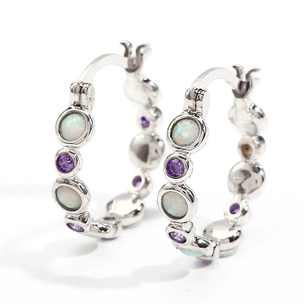 Round copper earrings with synthetic opal and cubic zirconia in platinum white finish