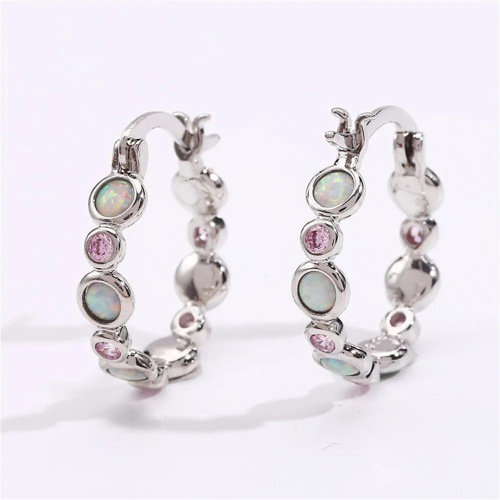 Round copper earrings with synthetic opal and cubic zirconia in platinum white finish
