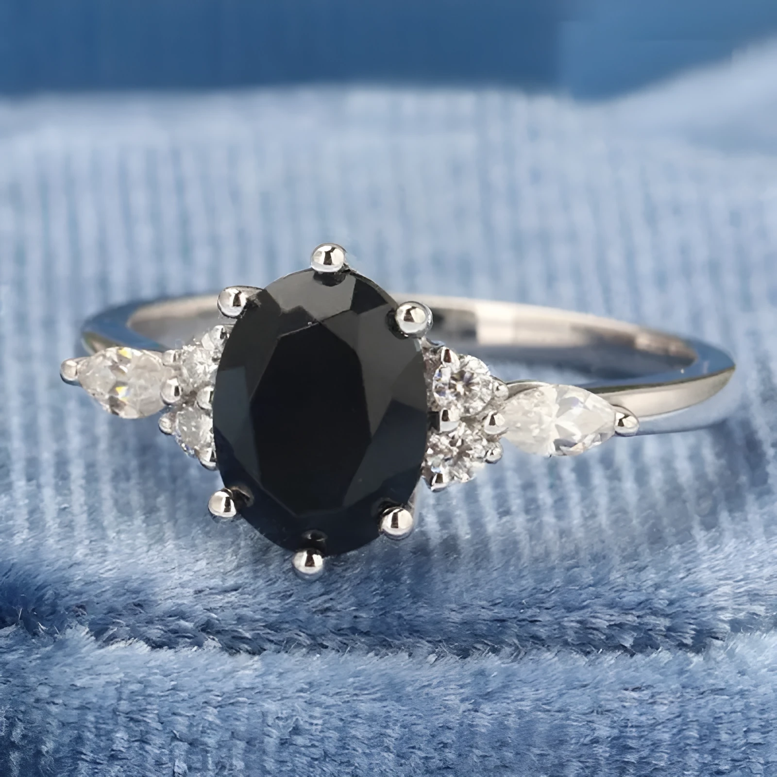 Silver zinc alloy flower shaped emerald zircon ring on white background