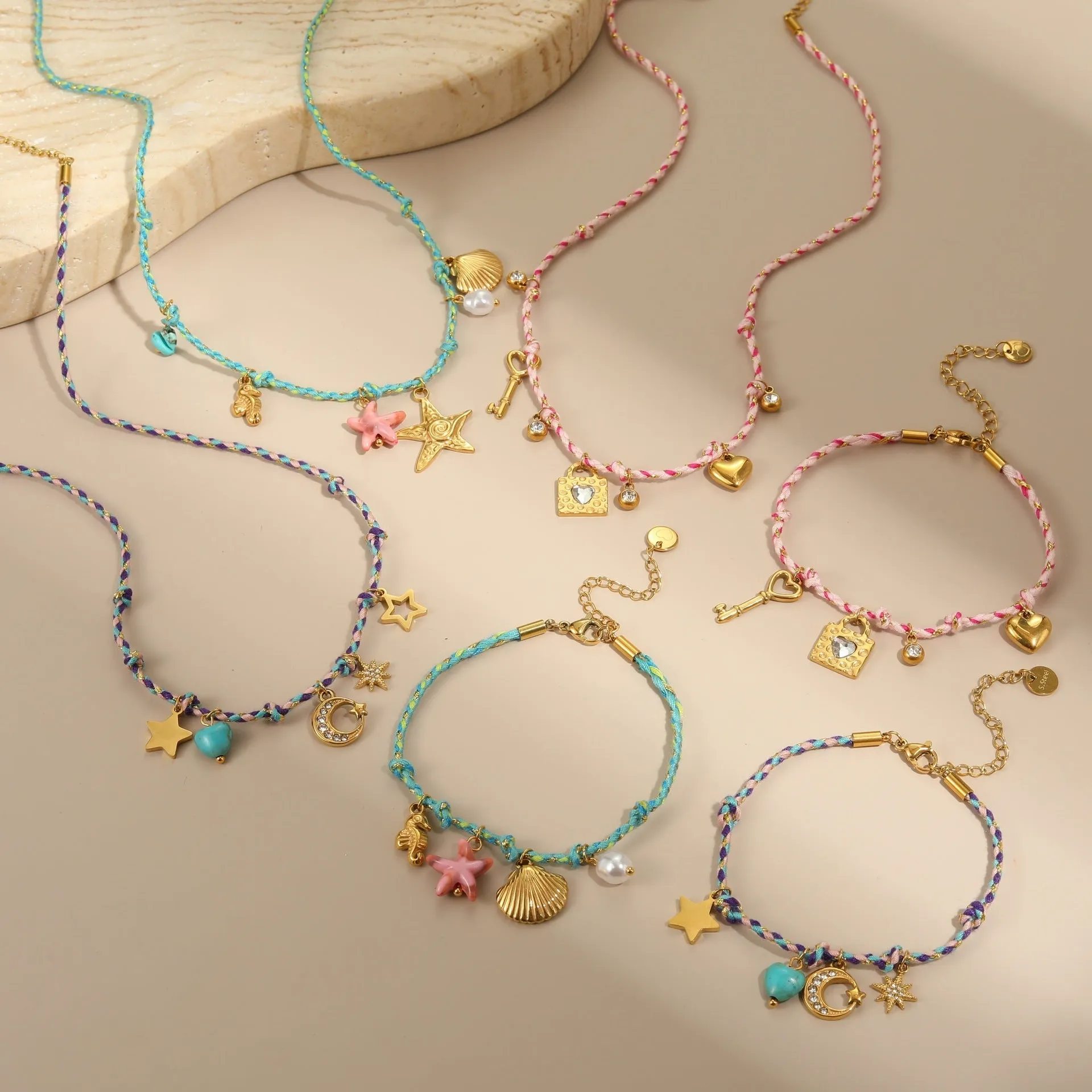 Handmade stainless steel necklace with coloured braided rope detail and geometric pendant
