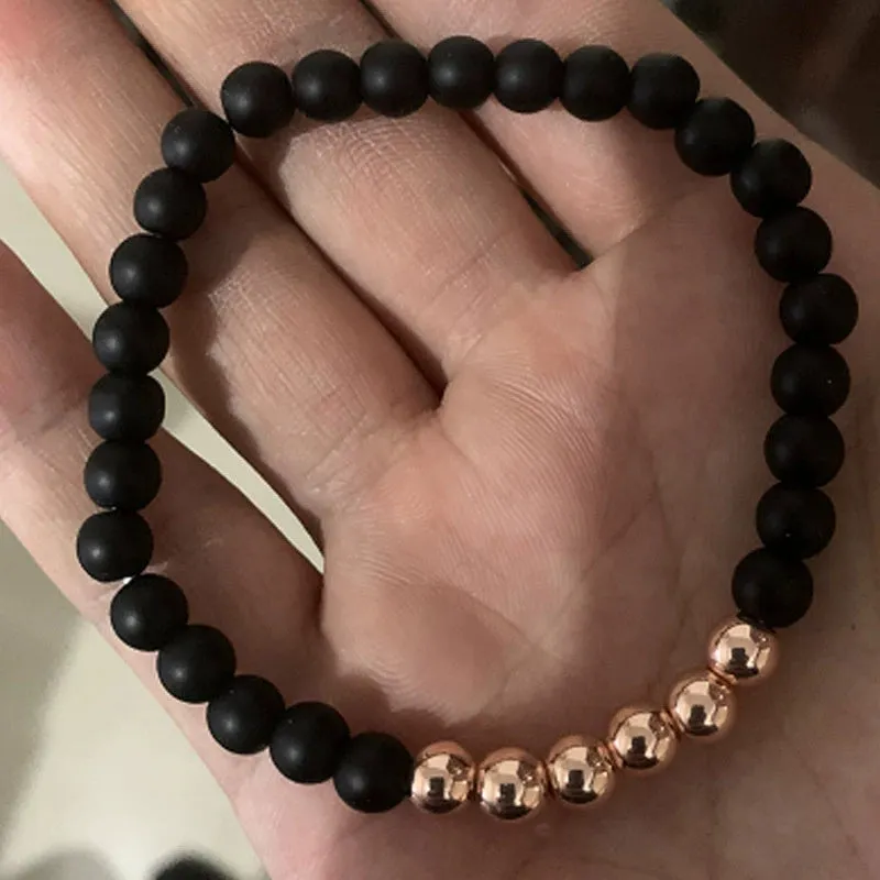 Micro-inlaid crown 6mm matte black copper bead bracelet with copper inlaid zircon on white background