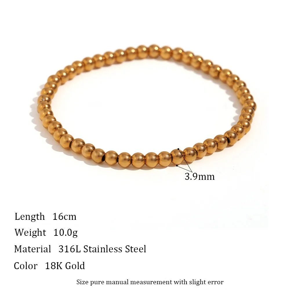 Stainless steel plated elastic bead bracelet with round geometric beads in gold finish