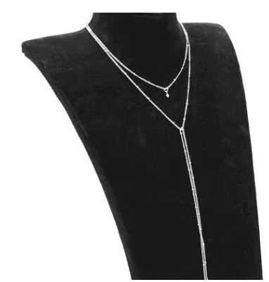 Multilayer lariat necklace in gold alloy plating with two layered strands and extension chain on white background
