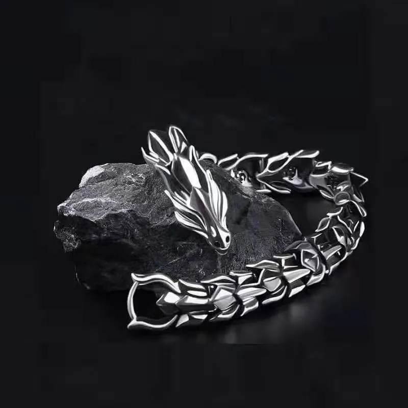Men's silver geometric keel shape alloy bracelet on a neutral background showing minimal design