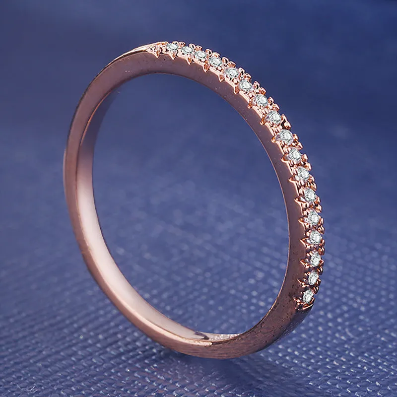 Women's crystal band ring in rose gold finish with cubic zirconia stones, US size 7