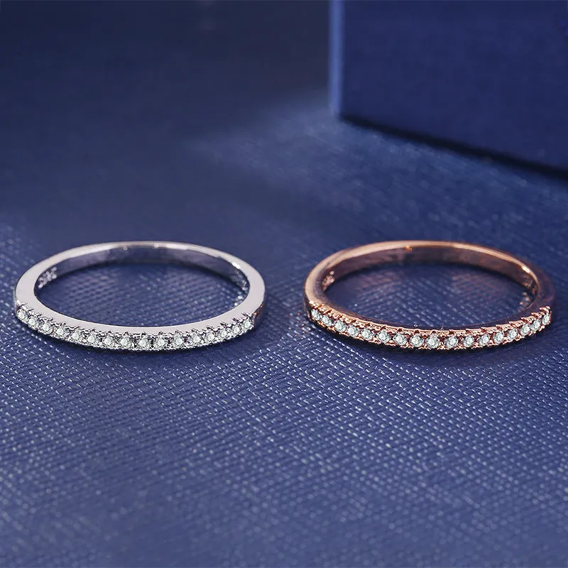 Women's crystal band ring in rose gold finish with cubic zirconia stones, US size 7